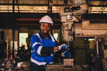 Production engineers are assisting adjusting and maintaining factory machine, Male workers...