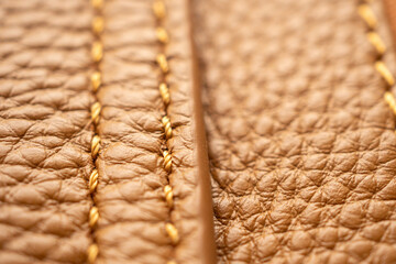 luxury brown leather bag texture background with stitching