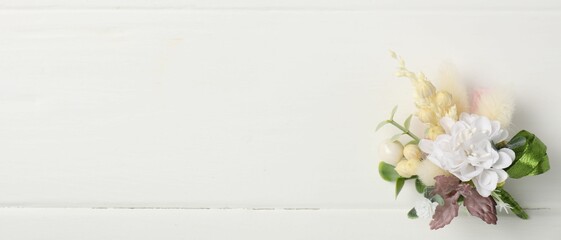 Beautiful boutonniere on white background, top view. Space for text © New Africa