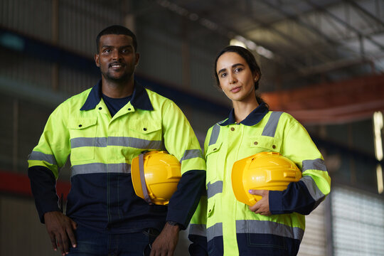 Engineer, Workers in a busy warehouse engage in various tasks, showcasing a collaborative team effort in an industrial setting, with a focus on safety and efficient work practices
