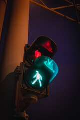 Pedestrian traffic light at night. Attention showing lights. synchronized lights, Navigating the...