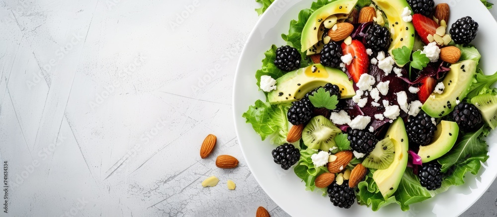 Aufkleber blackberry salad with greens almond nuts feta avocado and feta cheese. with copy space image. place 