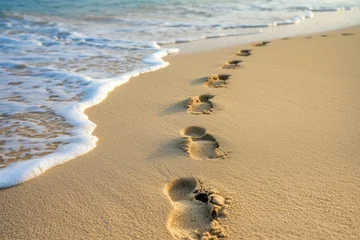 Fotobehang footprints in the sand. footprints on the beach © Vasili