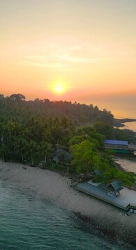 Drones are flying over Koh Phitak or Phithak island in Chumphon, Thailand, Vertical Video.