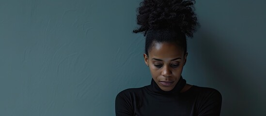 Obraz premium Young african american business woman waiting message from mobile during working Lack of concentration at work. with copy space image. Place for adding text or design