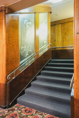 Mahagony wood paneled stairs and staircase in Art Deco style interior design architecture onboard...