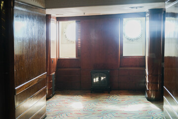 Wood paneled Art Deco interior design architecture inside lounge bar public space onboard ocean...