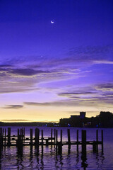 Twilight Serenity at Abandoned Dock with Crescent Moon in Infrared