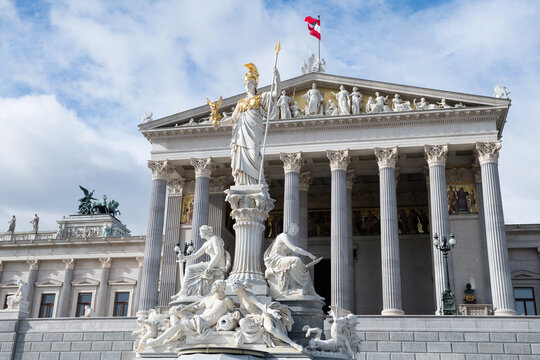 Austrian parliament building with Athena statue and fountain in front. Vienna, capital city of Austria