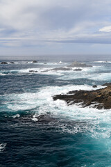 Waves splashing along the rocky California ocean coastline