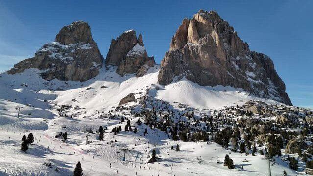 Dolomites in winter. Snowy mountains and ski resort.