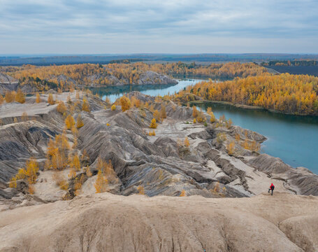 Aerial view of a river with trees in autumn colours in Konduki, Tula region, Russia.
