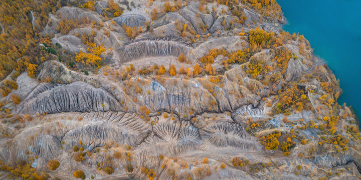 Aerial view of a river with trees in autumn colours in Konduki, Tula region, Russia.