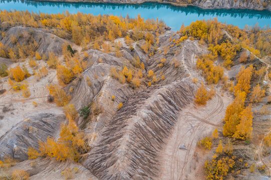 Aerial view of a river with trees in autumn colours in Konduki, Tula region, Russia.