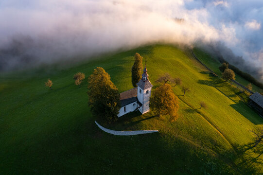 Aerial drone view of the beautiful hilltop church of Sveti Tomaz (Saint Thomas) Skofja loka, Slovenia.