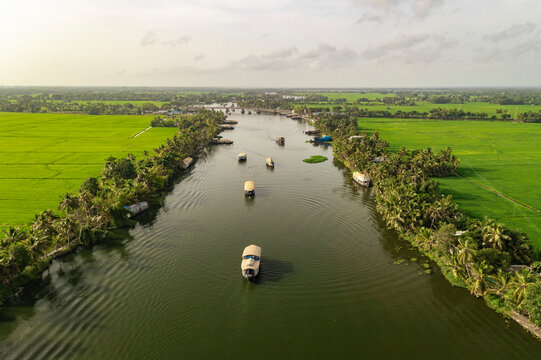 Aerial view of boats sailing the river water in Alappuzha, Kerala, India.