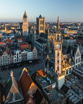 Aerial view of Sint Niklaaskerk (Saint Nicholas' Church) and the Gildenhuis van de Vrije Schippers clock tower in Gent downtown, Ghent, East Flanders, Belgium.