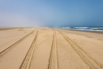 Car tire tracks in the sand of Skeleton Coast, Namibia - 741682779