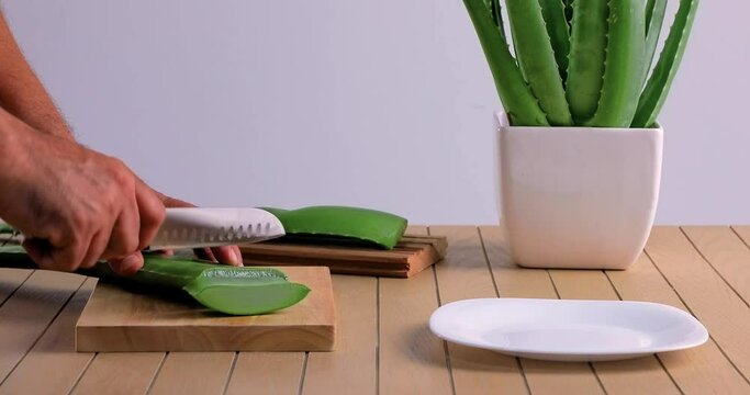 video of aloe vera being cut and chopped on chopping board