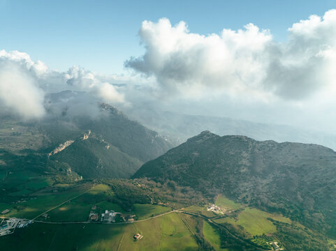 Aerial view of Trentinara, a small town on the mountain peak with low clouds, Salerno, Campania, italy.