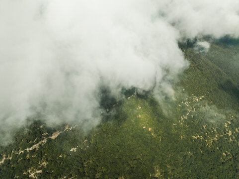 Aerial view of low clouds on the mountain peak in Capaccio near Paestum, Salerno, Campania, italy.