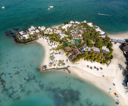 Aerial drone view of 5 star resort Shangri - La Le Touessrok with sandy beach, white villas and pool, Ilot Lievres, Flacq, Mauritius.