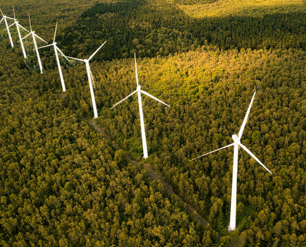 Aerial drone view of wind turbines in a tropical forest, Bras d'Eau National Park, Flacq, Mauritius.