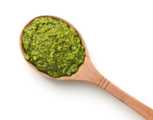 Wooden spoon of pesto sauce