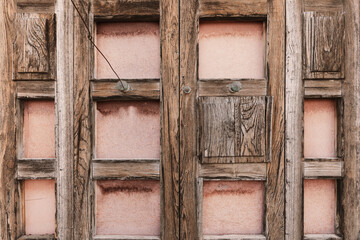 Front view of old wooden door, grunge background