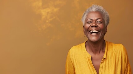 Joyous African American Senior Woman in Yellow Blouse Laughing with Cloudy Backdrop.