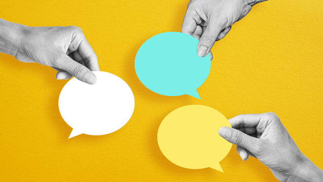 Business communication breakdown concept. Lack of communication skills. Businessmen drawing speech balloons. Hands with speech balloons