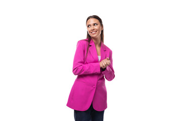 young stylish business assistant woman dressed in a bright pink jacket