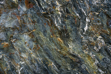 Stone pattern, granite rock surface, colored rock detail texture, rock structures, marble granite deposit.