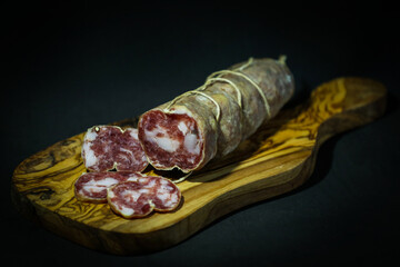 Campania village salami on a black cutting board