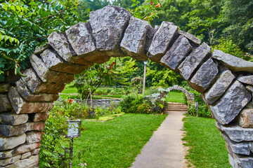 Rustic Stone Archway in Lush Garden Path Perspective