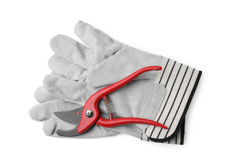 Pair of gardening gloves and secateurs isolated on white, top view