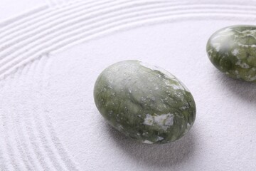 Stones on sand with pattern. Zen concept
