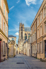 Narrow pedestrian street in old historical city centre, Cathedral Basilica of Our Lady of Amiens Notre-Dame, vertical view, Amiens cityscape, Somme department, Hauts-de-France Region, Northern France - obrazy, fototapety, plakaty