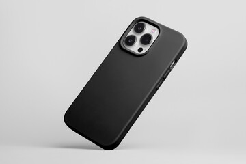 iPhone 15 Pro in black soft silicone case falls down back view, smartphone mockup isolated on grey background