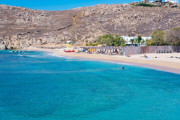 Mikonos, Greece: Agrari Beach with blue sea, wild and quiet, famous for diving, snorkeling and water activity. As most beaches in Mykonos, Agrari Beach is naturism friendly.