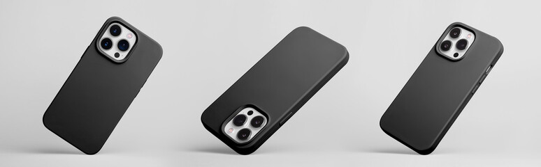 set of three iPhone 15 and 14 Pro max in black silicone case falling down in different angles, back...