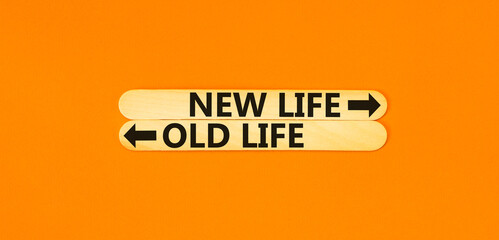 New or old life symbol. Concept word New life Old life on beautiful wooden stick. Beautiful orange...