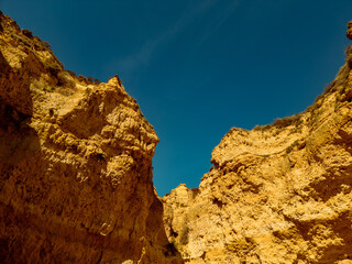 Rugged canyon walls under a clear blue sky.