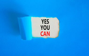Motivational and Yes you can symbol. Concept words Yes you can on beautiful white paper. Beautiful blue paper background. Business motivational and Yes you can concept. Copy space.