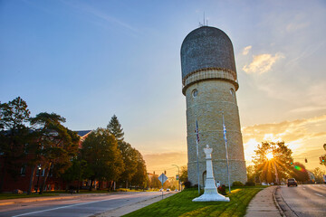 Golden Hour at Ypsilanti Water Tower with Flags - obrazy, fototapety, plakaty