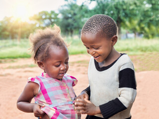 Ngo volunteer organizations around the world helping african children. Happy village boy and girl...