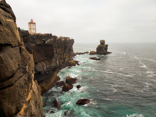 Fototapeta na wymiar lighthouse on the rocks