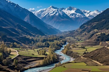 Fototapeta premium A river flowing through a valley in the Swiss Alps