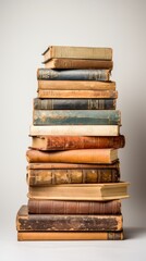 Stack of old antique vintage retro aged hardcover books isolated on white background