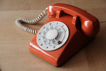 old retro handset phone orange color ring dial nostalgic design